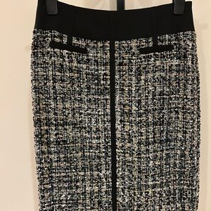 Chanel like fabric. Multi tweed with slight amounts of lurex. Stunning !